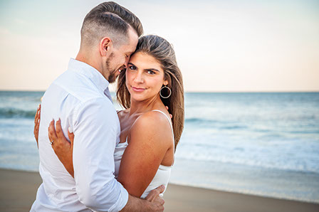 Cute couple celebrating their engagement while vacationing in Corolla, North Carolina in the Outer Banks